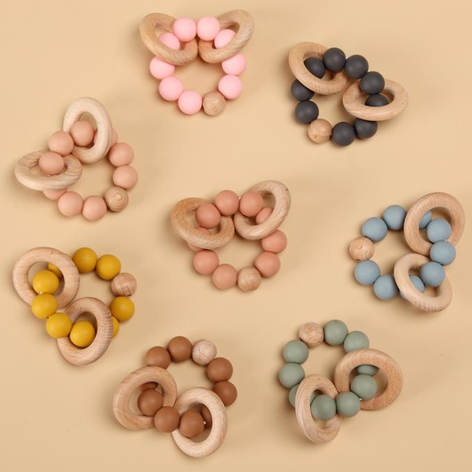 Kundenspezifisches umweltfreundliches freies Silikon Teether des Baby-Zahnenspielzeug-BPA mit hölzerner Ring Soft Toy 7.5*6*4cm Eco freundlicher KN DL13M03;GUA