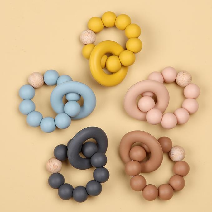 Großhandelsnaturkautschuk-Säuglingssilikon-organisches Baby Teether-Spielzeug mit einem Ring