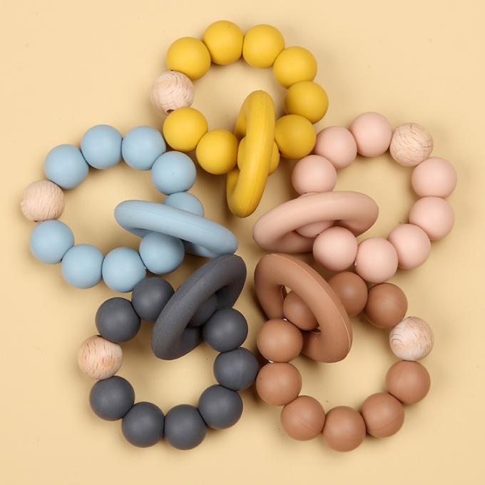 Großhandelsnaturkautschuk-Säuglingssilikon-organisches Baby Teether-Spielzeug mit einem Ring