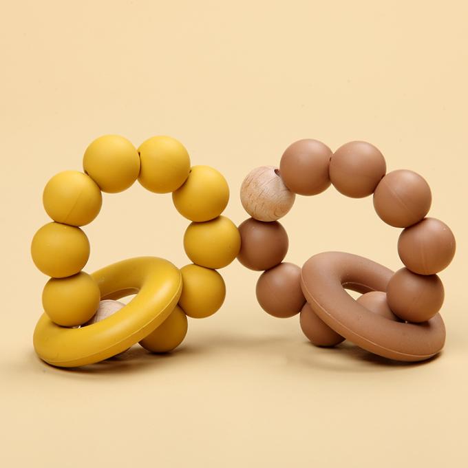 Großhandelsnaturkautschuk-Säuglingssilikon-organisches Baby Teether-Spielzeug mit einem Ring