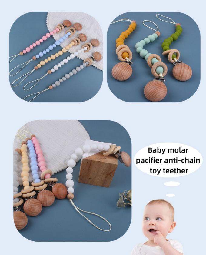 Umweltfreundliche Baby-Silikon-GroßhandelsHolzperle-blinde Baby-Friedensstifter-Ketten-Verhinderung mit Holzring